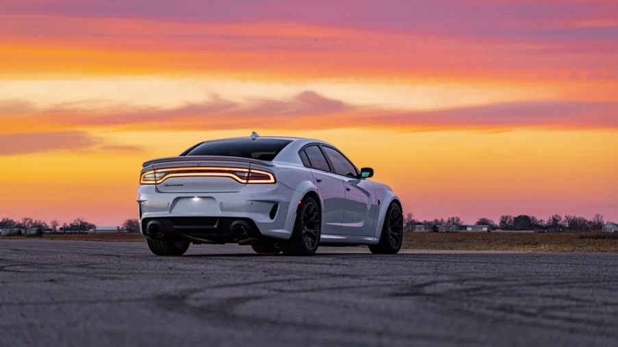 A Hennessey H1000 Hellcat Charger in white at sunset