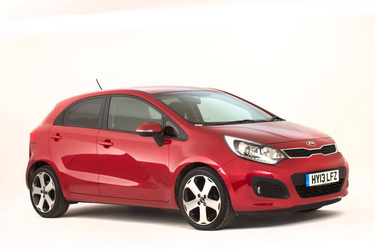A red 2013 Kia Rio subcompact car model photo from the National Motor Museum