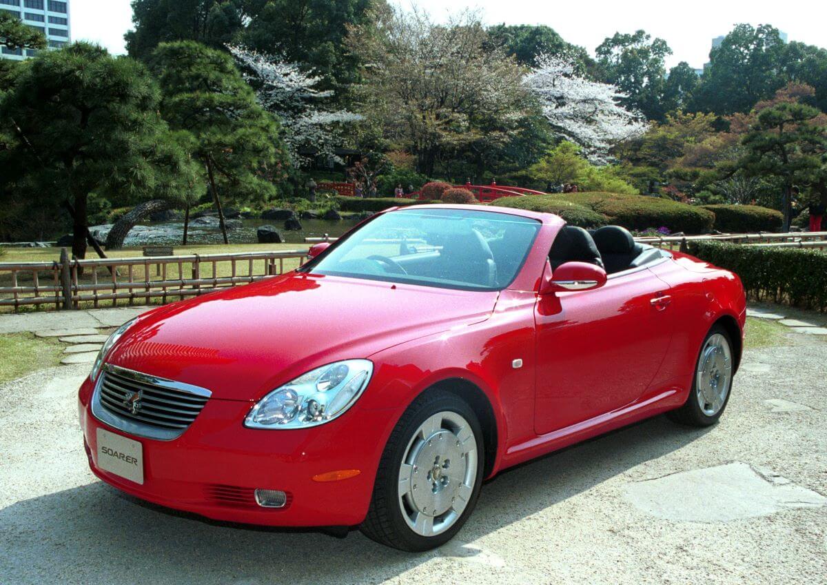 A red Toyota Soarer hardtop convertible coupe sports car model in Tokyo, Japan