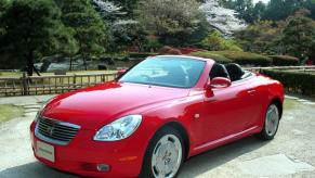 A red Toyota Soarer hardtop convertible coupe sports car model in Tokyo, Japan
