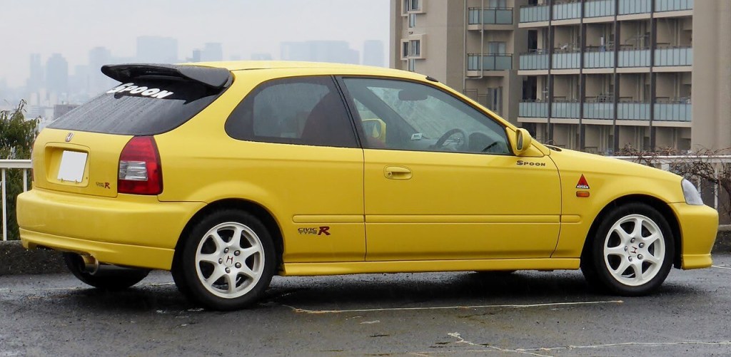 A yellow first-generation Honda Civic Type R built by Spoon Sports
