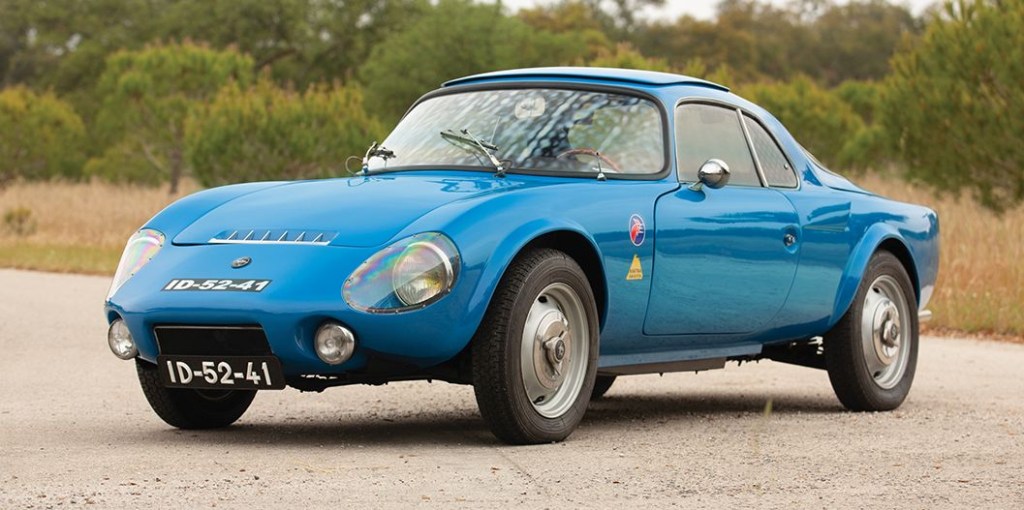 A blue 1967 Matra Djet parked on a gravel road