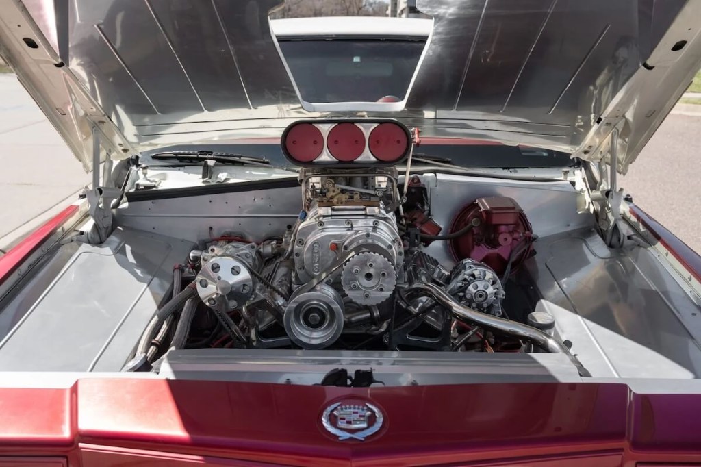 A 454 big block V8 in the engine bay of a Cadillac Fleetwood Limousine