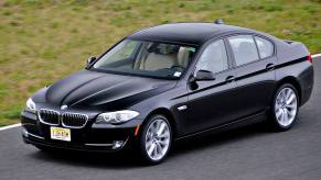 A 535i from the 2011, 2012, and 2013 BMW 5 Series lineup cruises around a corner.