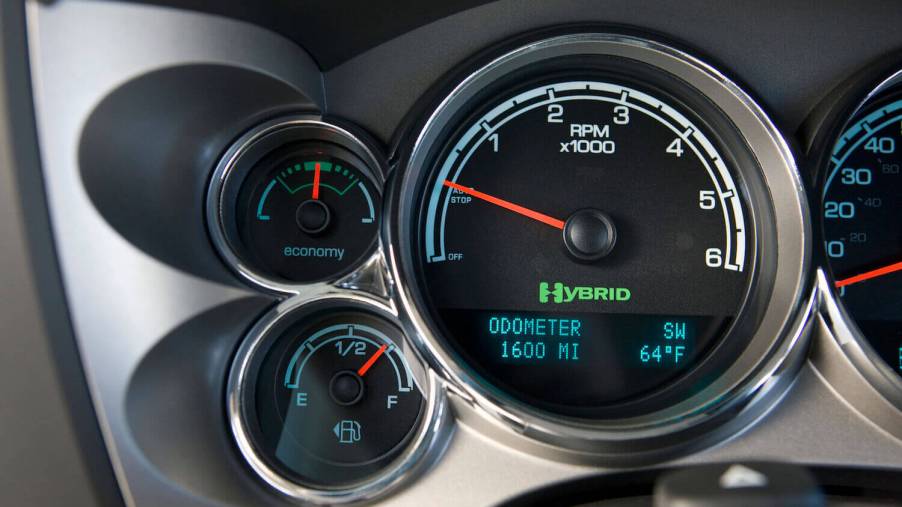 The Hybrid logo of the 2012 GMC Sierra being driven in "Eco" mode.