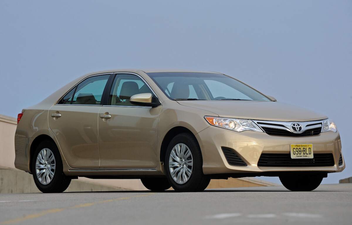 A 2012 Toyota Camry sedan parked on a road