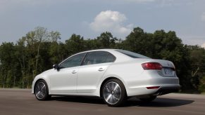 A used 2012 Volkswagen Jetta shows off its white paintwork and rear-end styling.