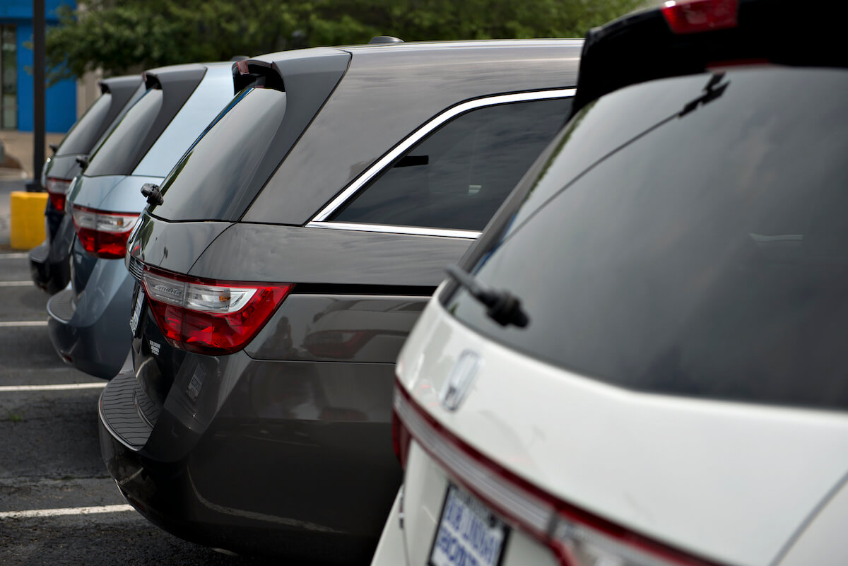 A 2013 Honda Odyssey lineup at a dealership