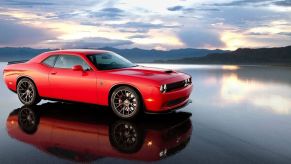 One of the best-sounding modern muscle cars, a 2015 Dodge Challenger SRT Hellcat poses on a salt flat.