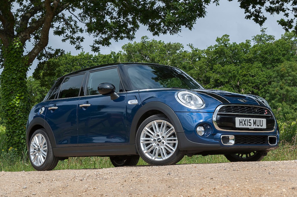 A blue 2015 Mini Cooper parked on a gravel road