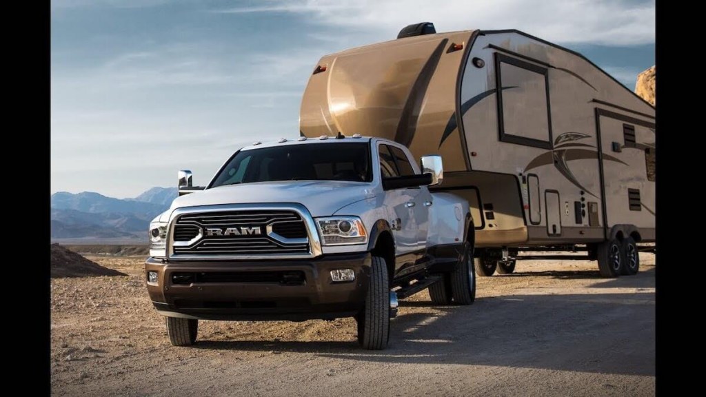 White 2018 Ram 3500 HD pulling trailer