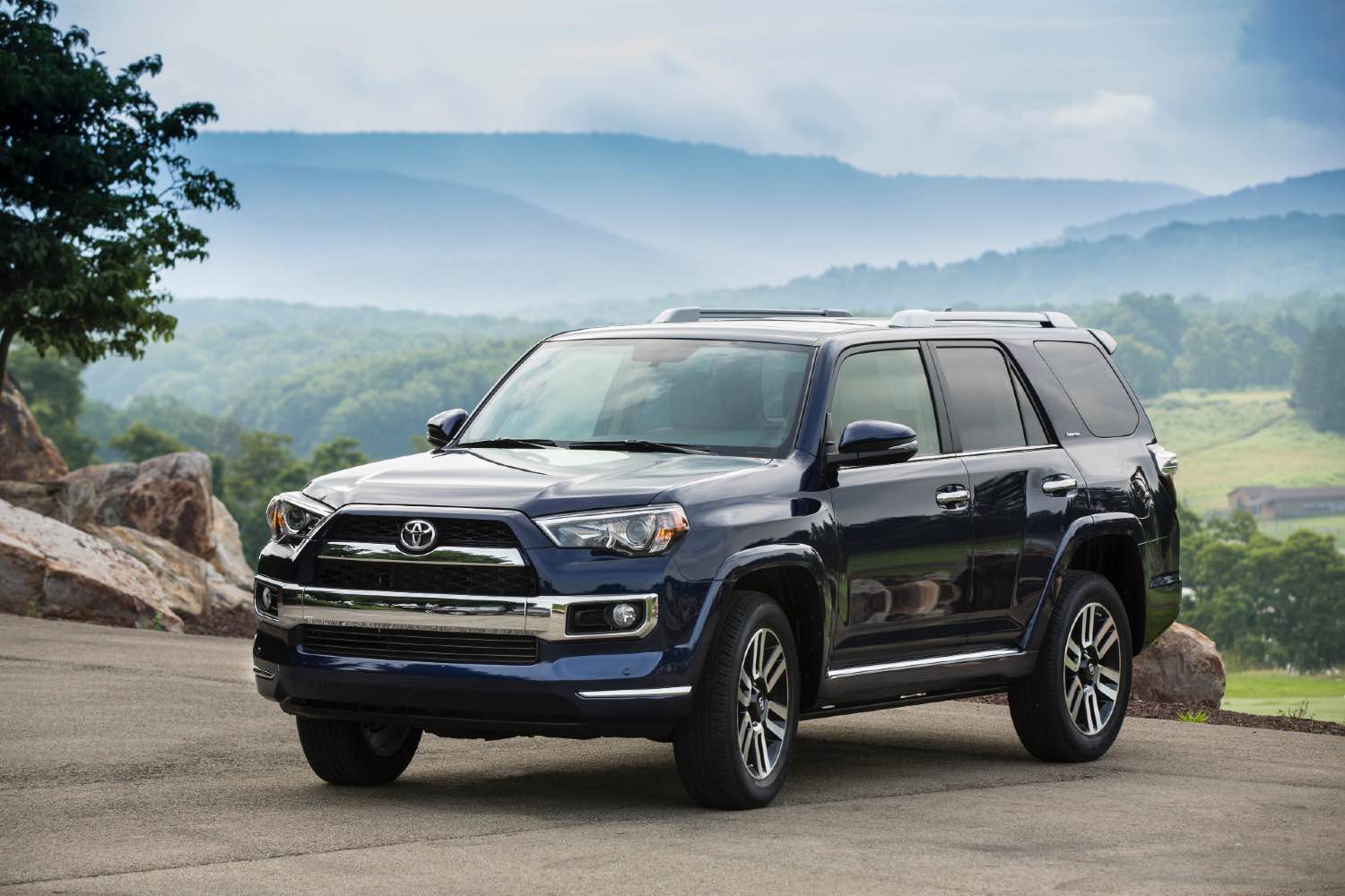 A blue 2018 Toyota 4Runner from the side.