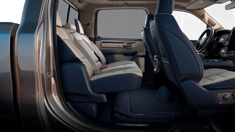 Floor-level view of the Ram 1500 crew cab interior with its rear seat reclined.