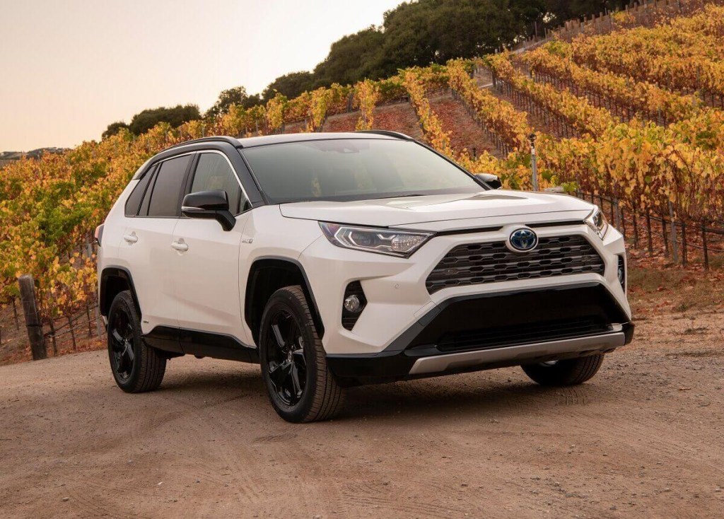 A Toyota RAV4 Hybrid model uses its Eco mode to reach a car path at a vineyard.