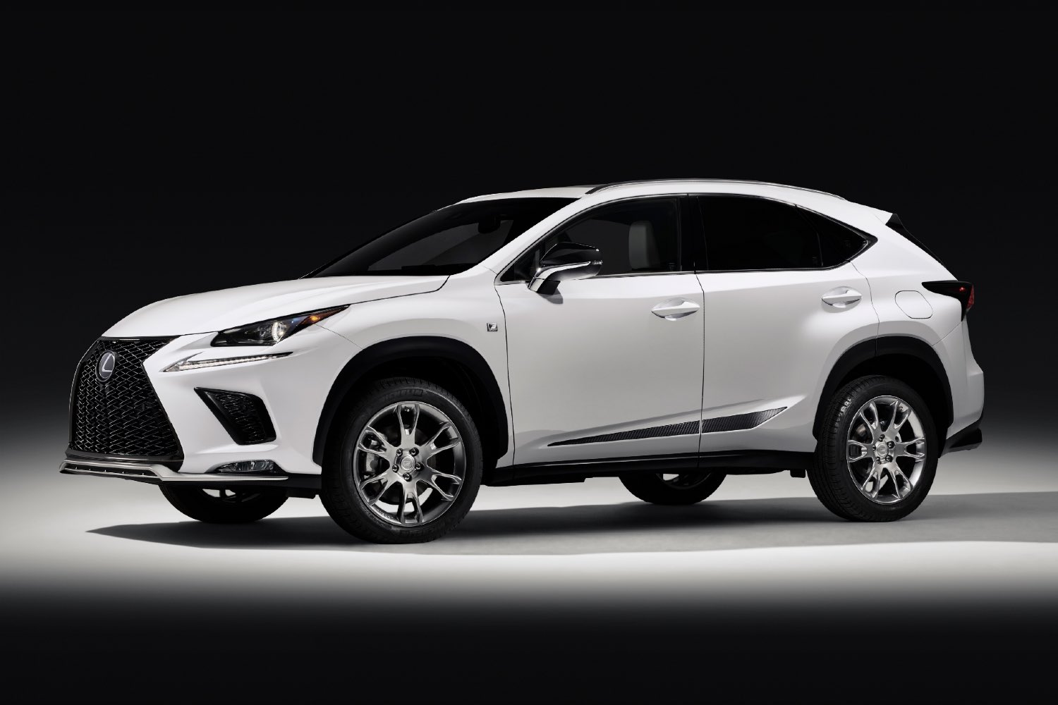 A white 2019 Lexus NX small SUV. 