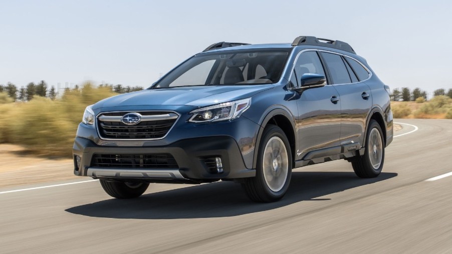 Blue 2020 Subaru Outback SUV Driving on a Highway