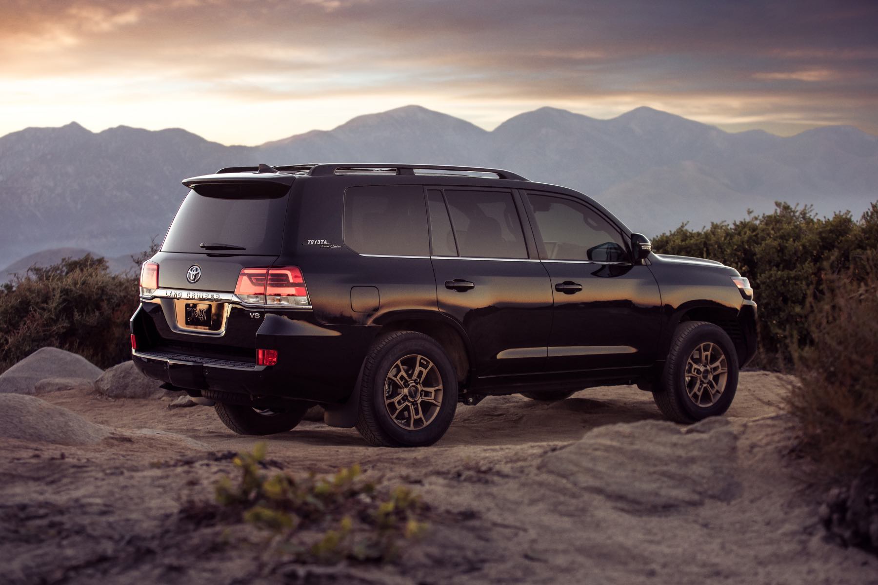 The 2021 Toyota Land Cruiser, the last model sold in the U.S., with mountains in the background.