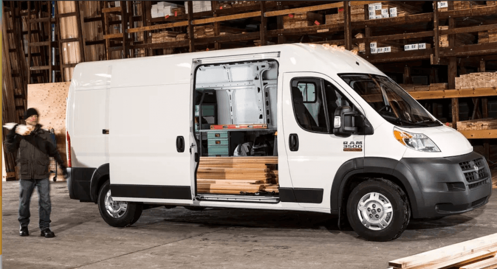 White 2021 Ram ProMaster van loaded at lumber yard