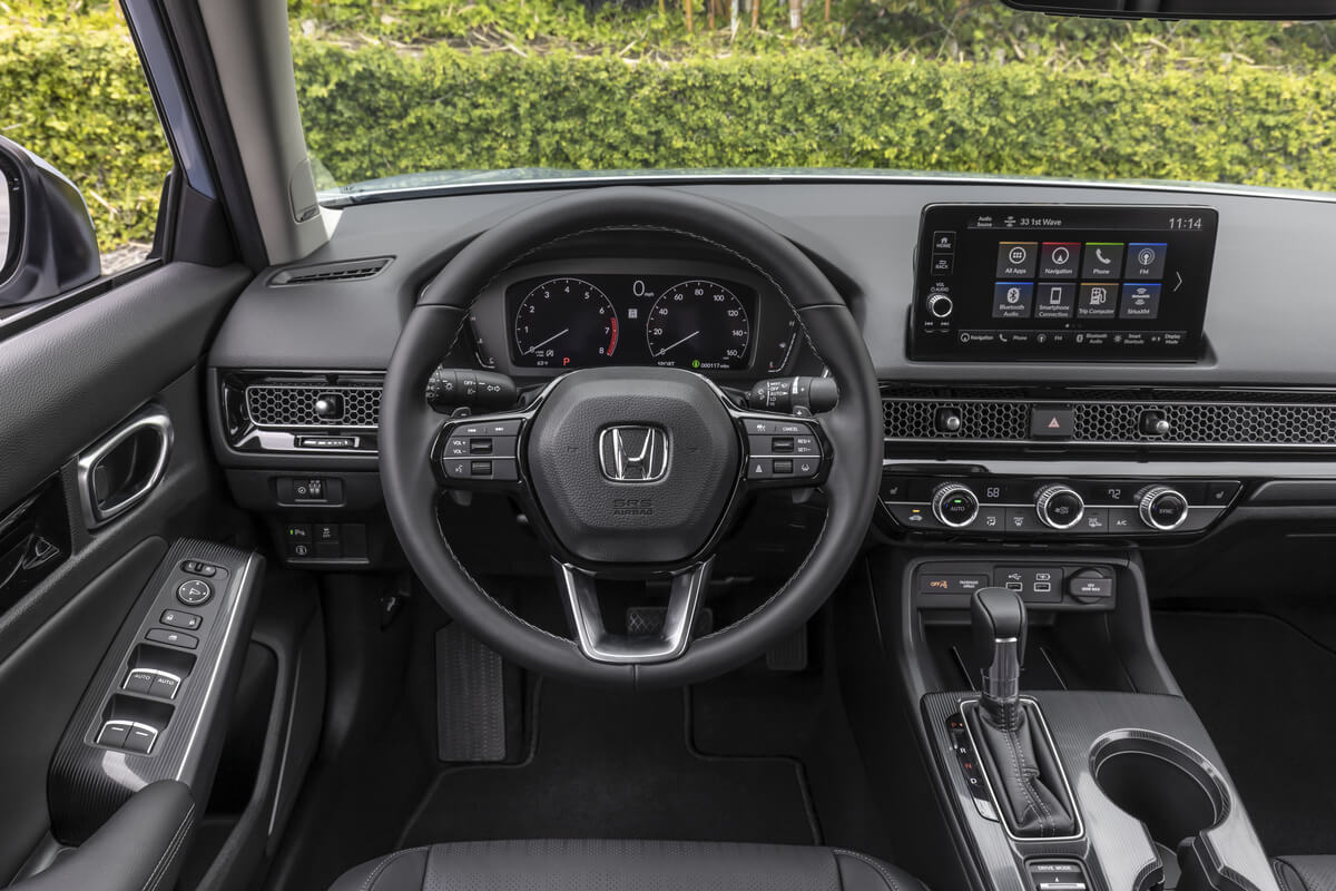 The interior and steering wheel in a 2022 Honda Civic