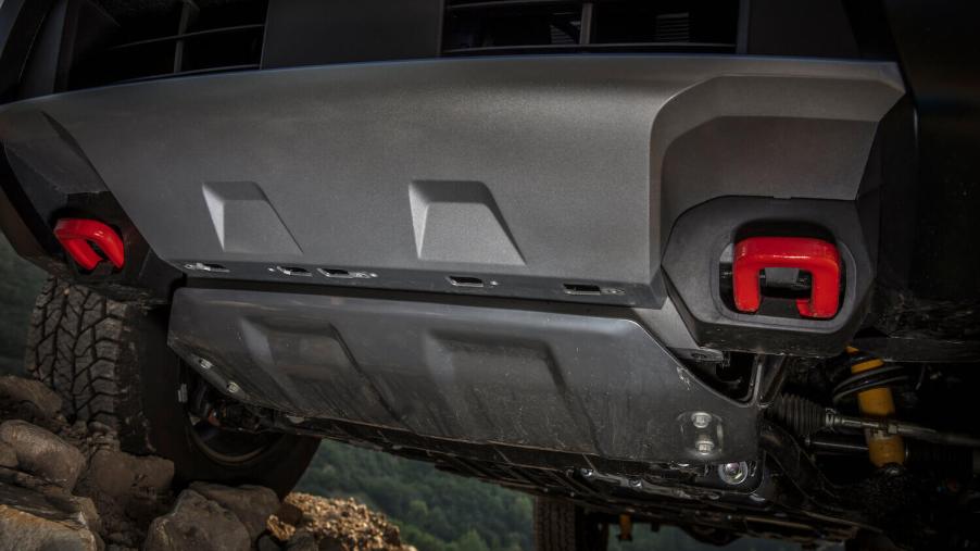 The skidplate of a Nissan Frontier off-road pickup truck.