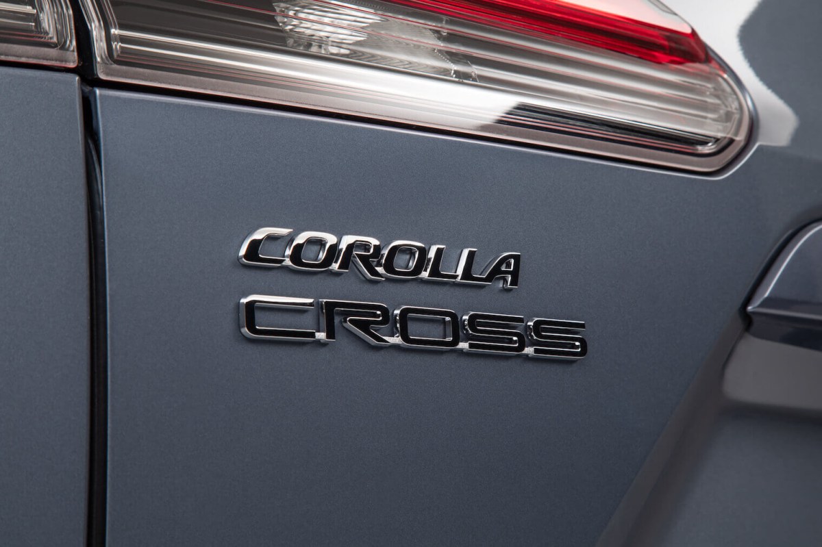 The rear badge of the 2022 Toyota Corolla Cross in gray.