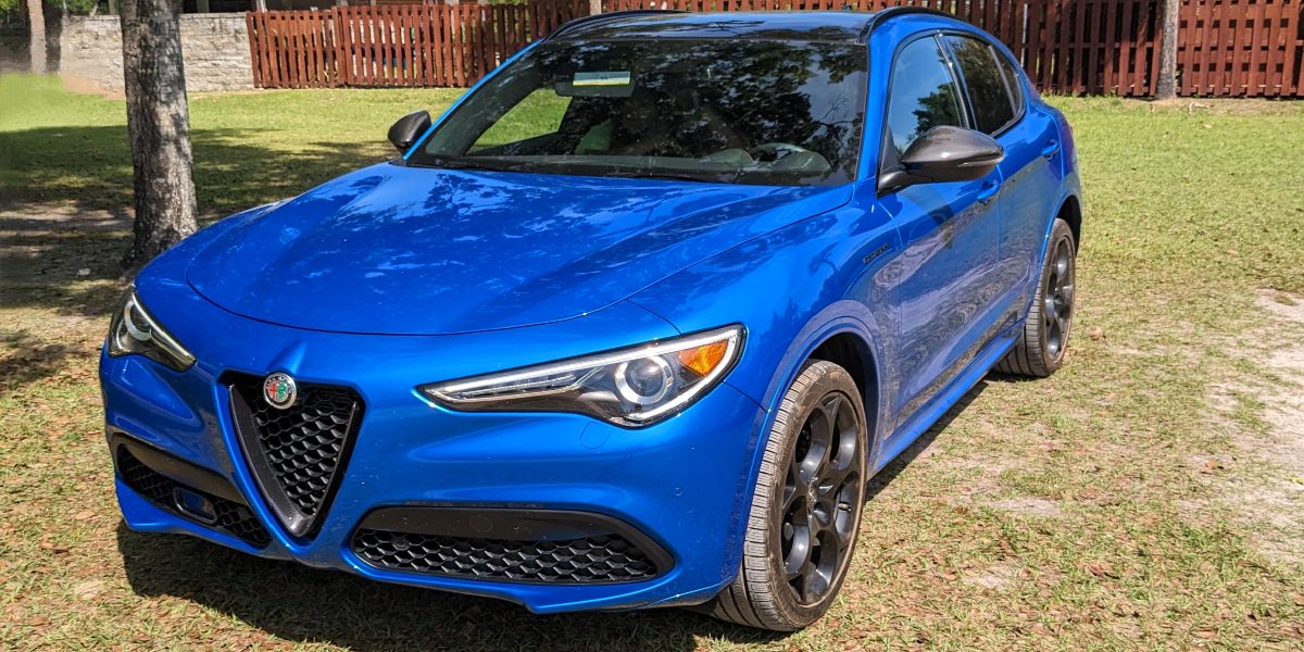 A blue 2023 Alfa Romeo Stelvio Ti AWD is parked in Florida.