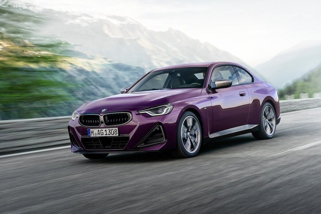 A purple BMW M240i xDrive shows off its front-end styling.