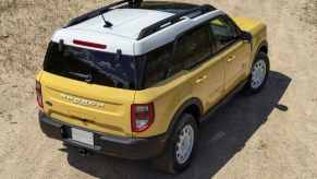 The back end view of a yellow 2023 Ford Bronco Sport Heritage Limited Edition.