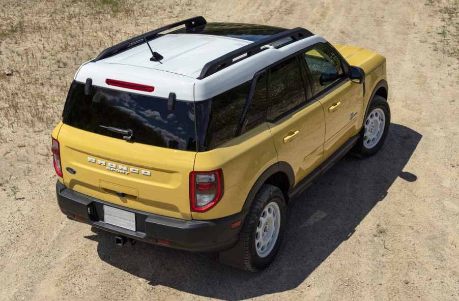 The back end view of a yellow 2023 Ford Bronco Sport Heritage Limited Edition.