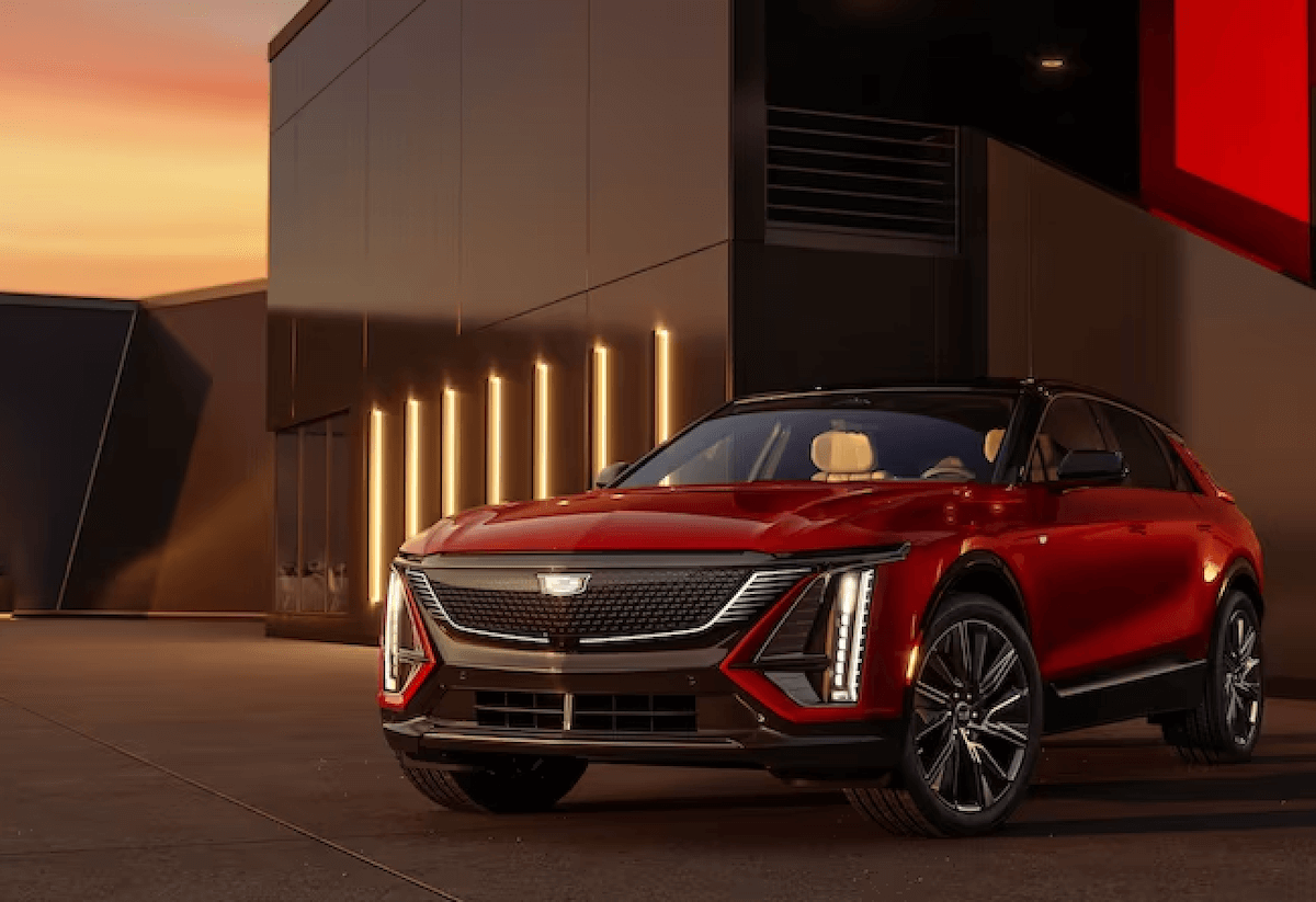 Red 2023 Cadillac Lyriq EV in front of building
