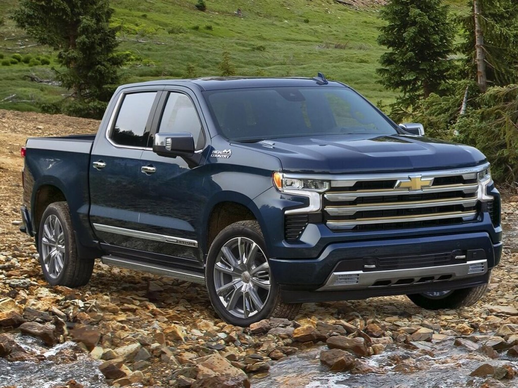 The 2023 Chevy Silverado Duramax diesel off-roading in a rocky river bed