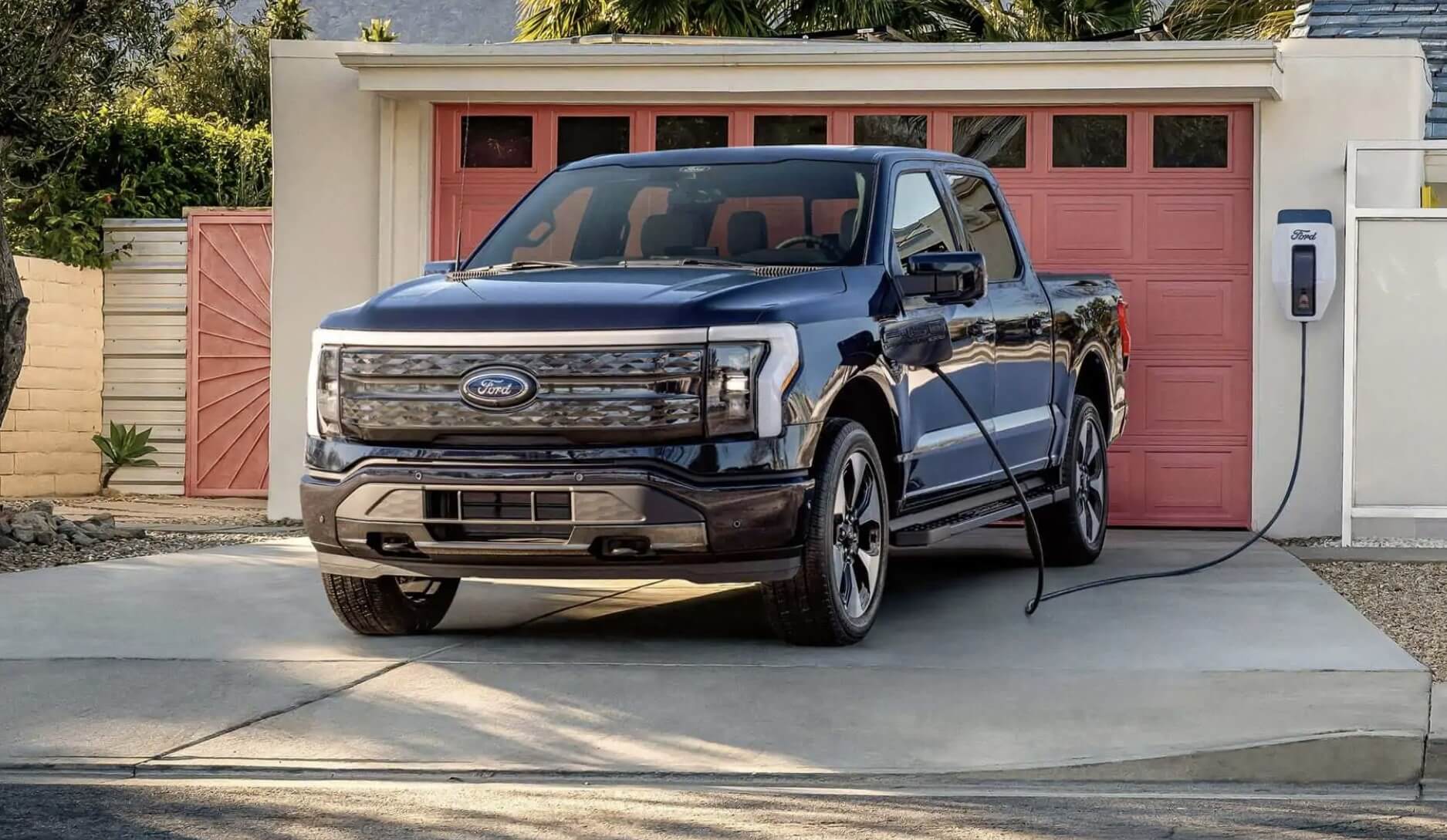 The 2023 Ford F-150 Lightning charging at home