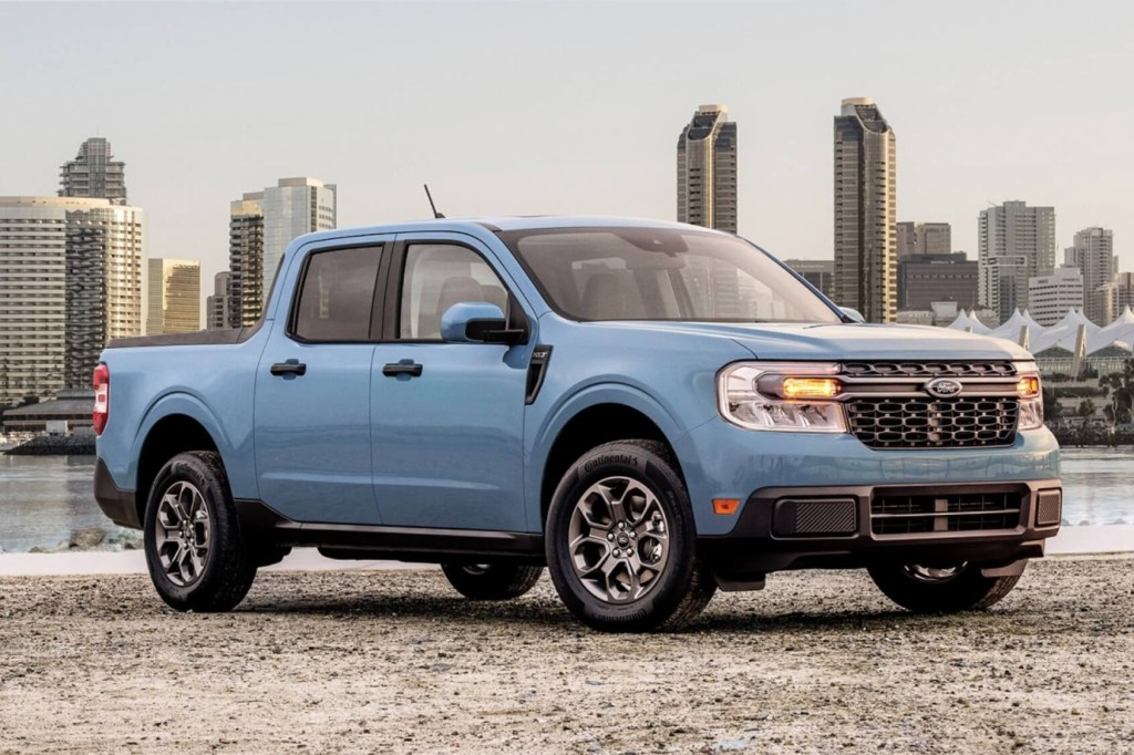 The 2023 Ford Maverick parked in front of a city