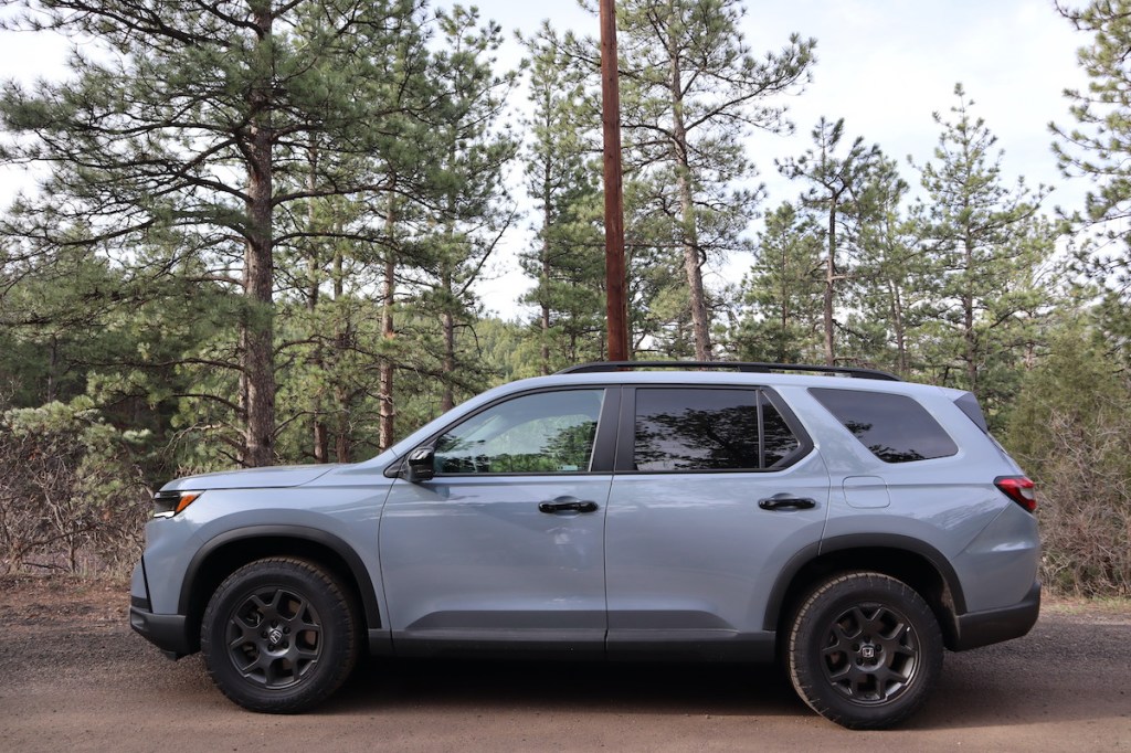 2023 Honda Pilot TrailSport side view on the trail