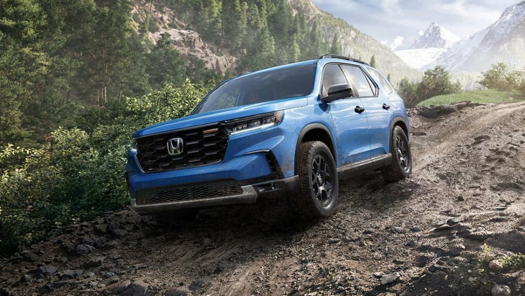 The 2023 Honda Pilot off-roading in the woods
