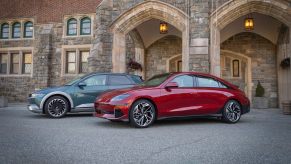 2023 Hyundai Ioniq 5 and 2023 Hyundai Ioniq 6 parked in front of a building.