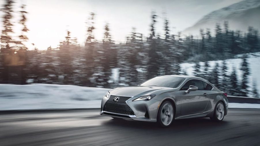 A gray 2023 Lexus RC driving on a snowy road.