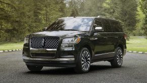 A black 2023 Lincoln Navigator full-size SUV is parked.