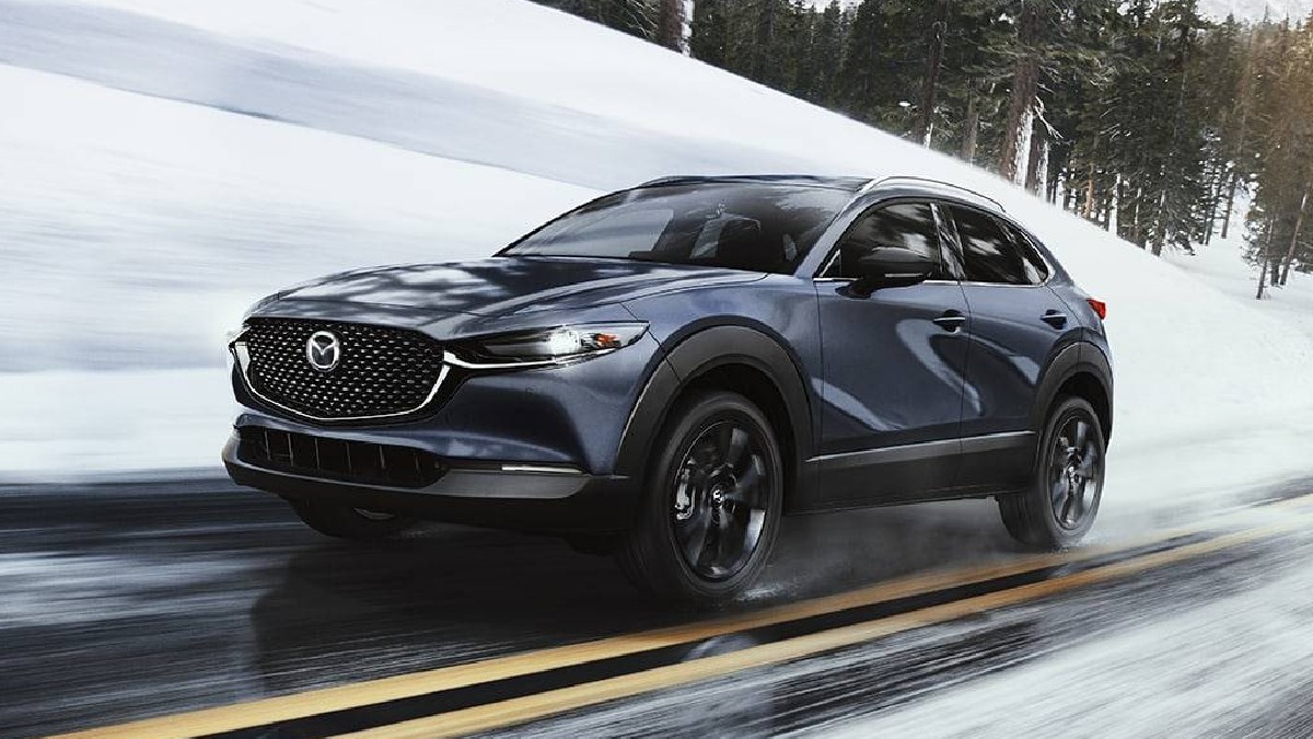 2023 Mazda CX-30, cheapest new all-wheel drive SUV, costs $23K and is best in class, driving on snowy road
