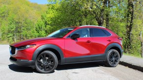 The side view of the 2023 Mazda CX-30 parked on pavement