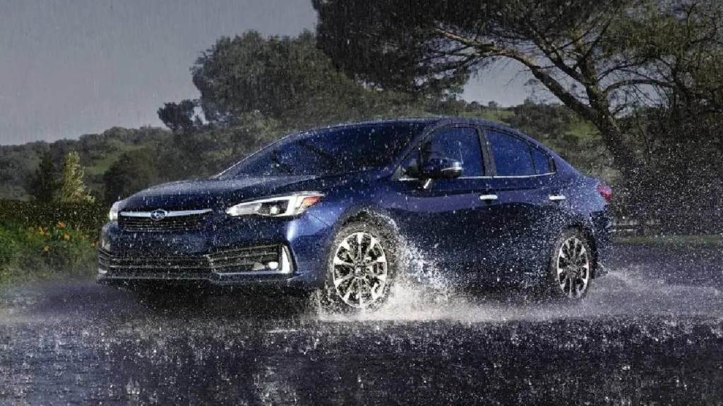 2023 Subaru Impreza, cheapest new all-wheel drive car costing only $19K, driving in the rain