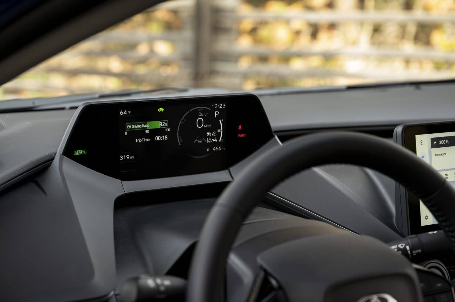 The dashboard of a Toyota Prius hybrid electric vehicle, showing engine status.