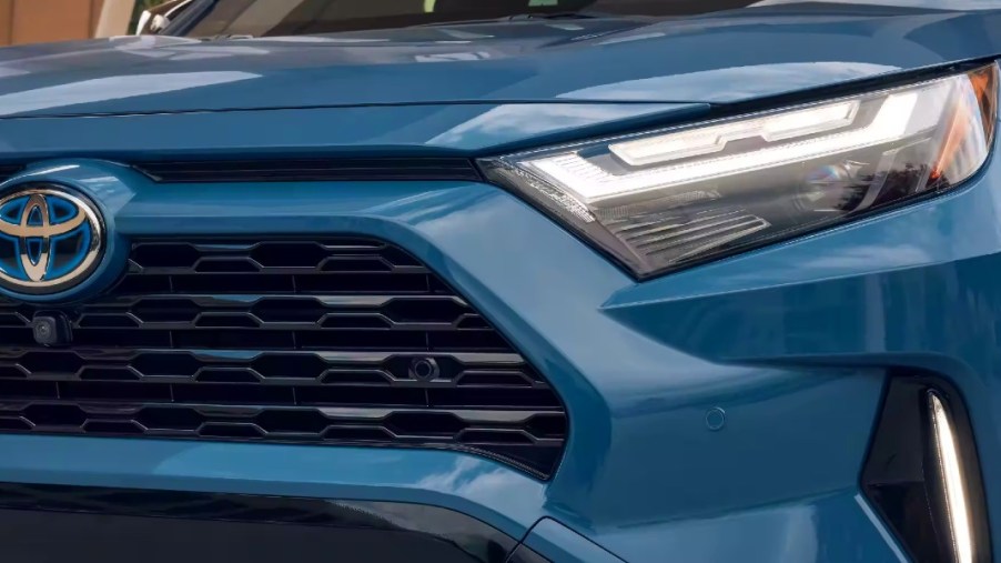 The front of a blue 2023 Toyota RAV4 Hybrid small SUV.