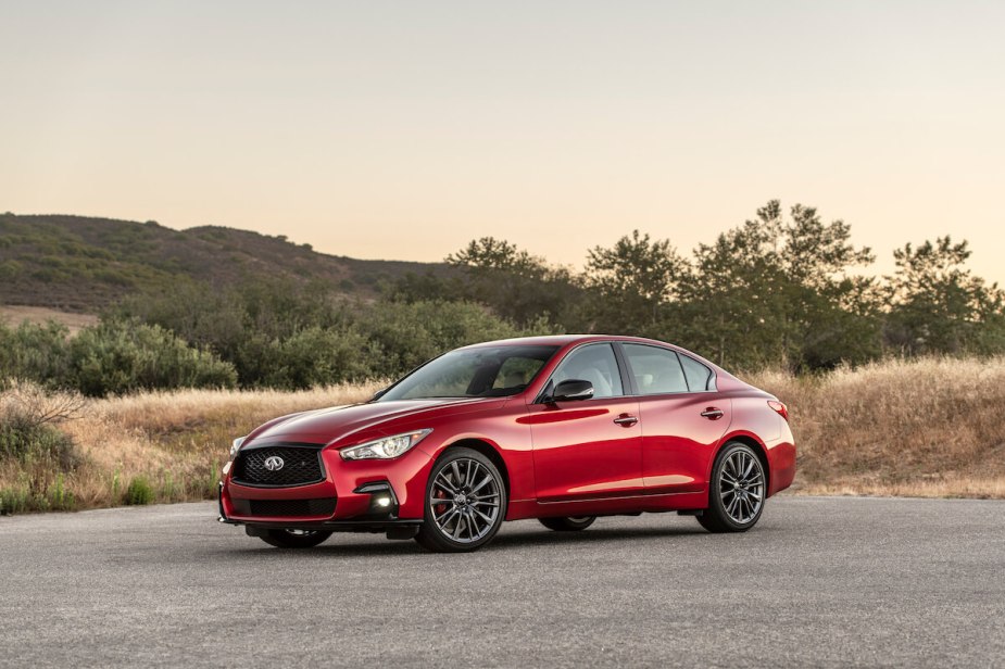 A red 2023 Infiniti Q50S parked on the road