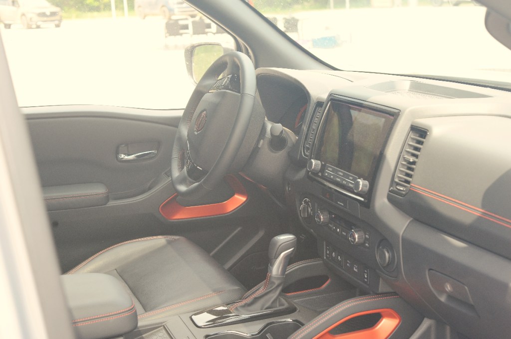 The interior of the 2023 Nissan Frontier midsize truck.