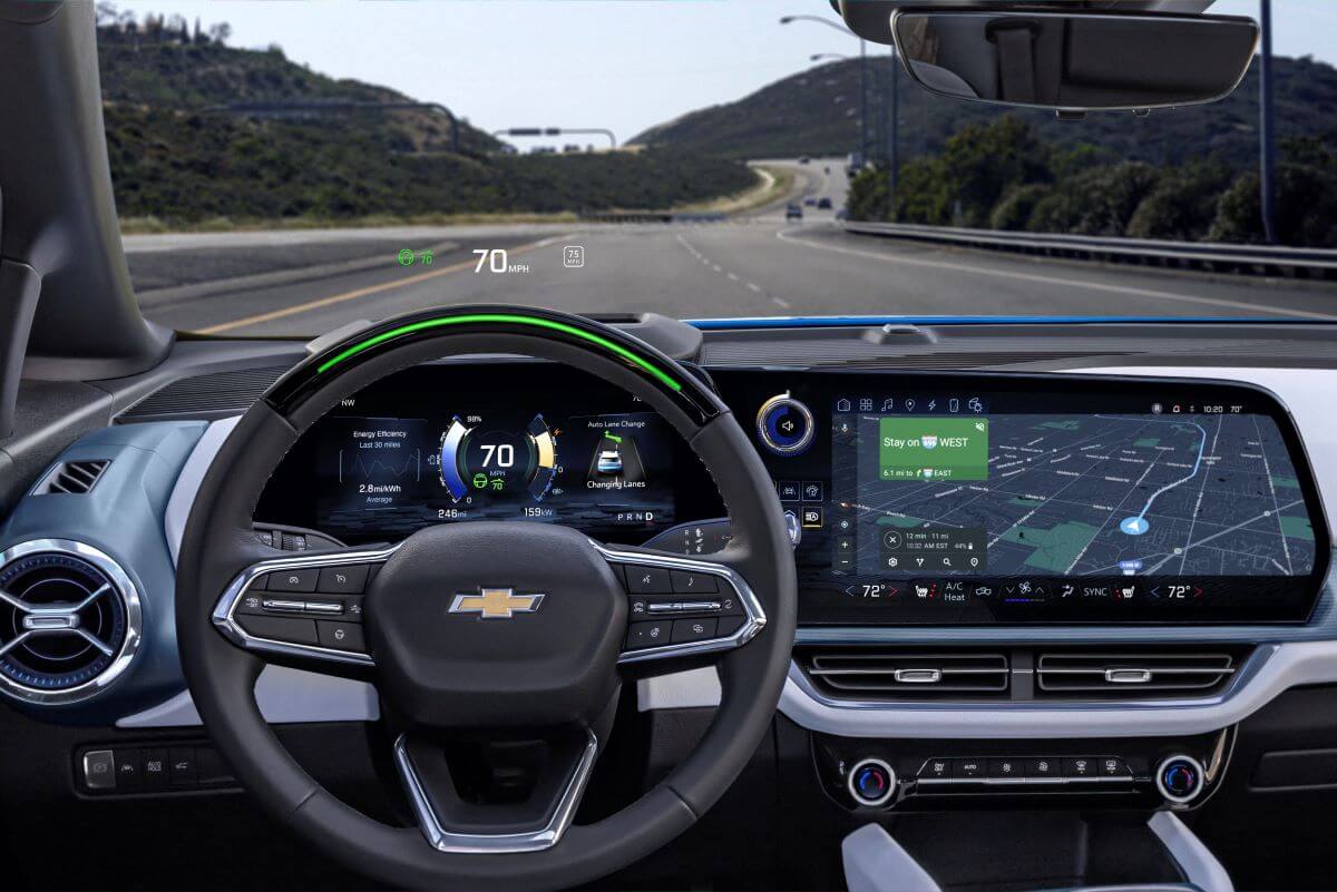 Driver's seat view of a 2024 Chevy Equinox EV 3LT with Super Cruise active and operating on a highway