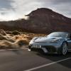 A gray 2024 Porsche 718 Spyder RS driving in the desert
