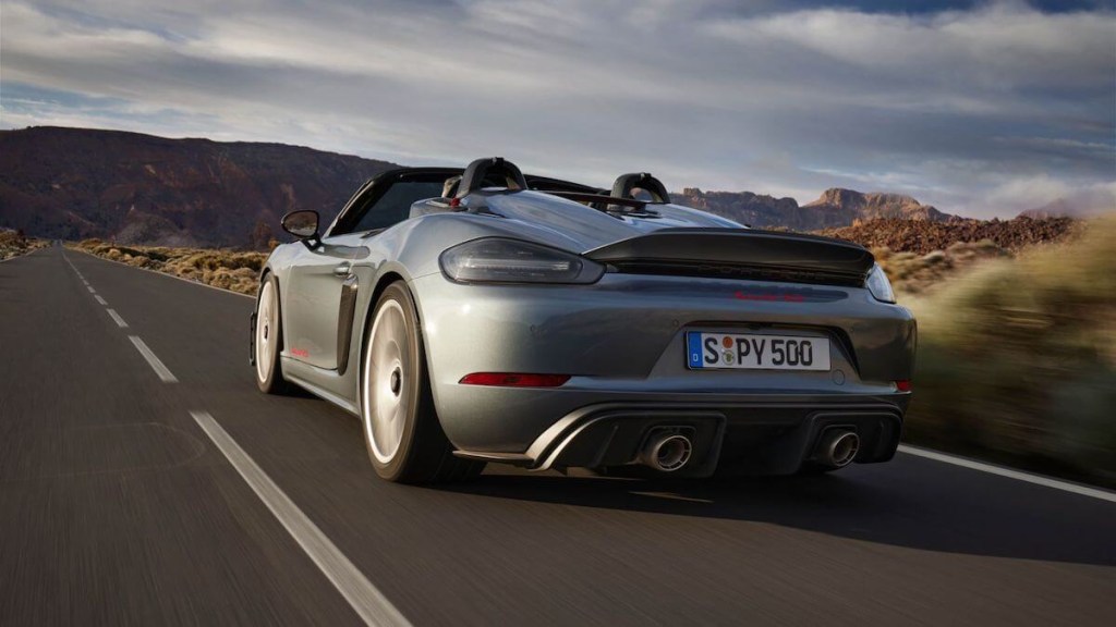 A gray 2024 Porsche 718 Spyder RS rear end while driving in the desert