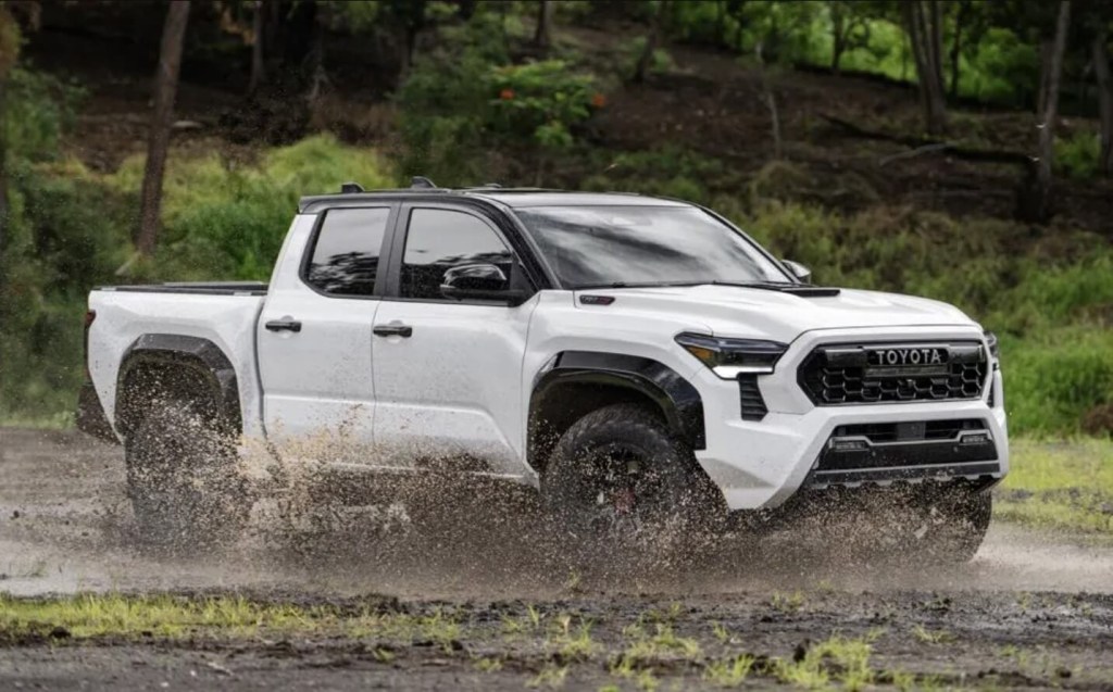 The 2024 Toyota Tacoma splashing through mud