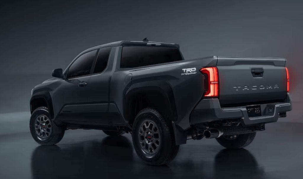 Toyota Tacoma PreRunner render in a dark grey color against a dark background.